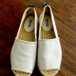 Michael Kors espadrilles. white canvas with logo in the back.